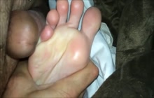 Rubbing my cock against her feet